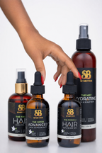 Female hand reaching for Senbetter botanical hair oil products