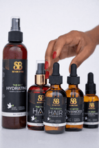 Female hand reaching for Senbetter botanical hair oil products