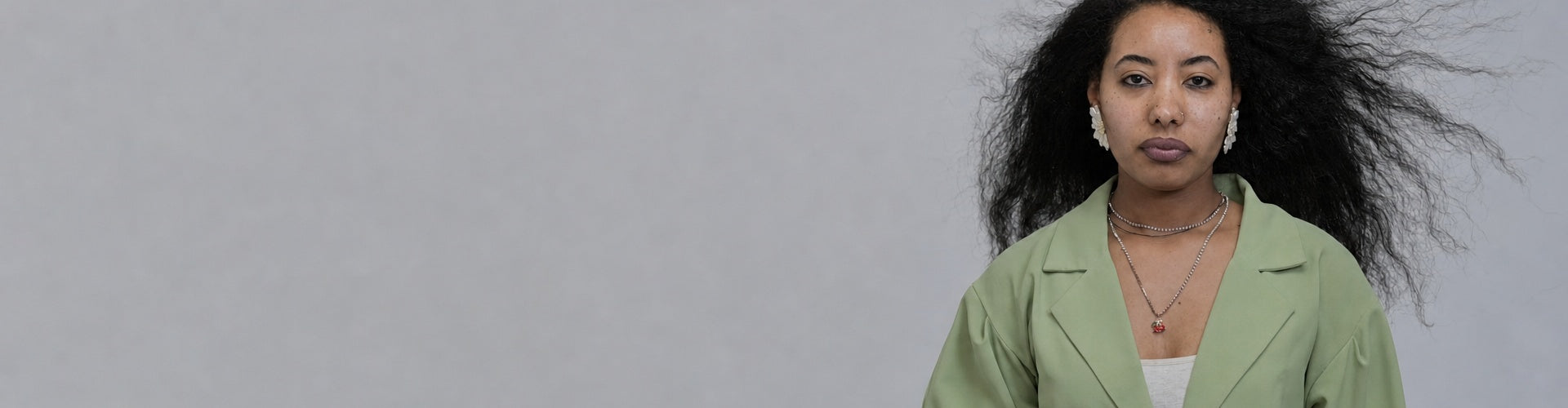 Woman with voluminous natural curly hair, Senbetter Start Your Hair Care Routine banner